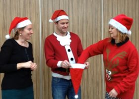 Treacy, Joey and Mary pick a name out of a santa hat