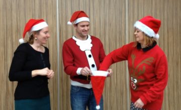 Treacy, Joey and Mary pick a name out of a santa hat
